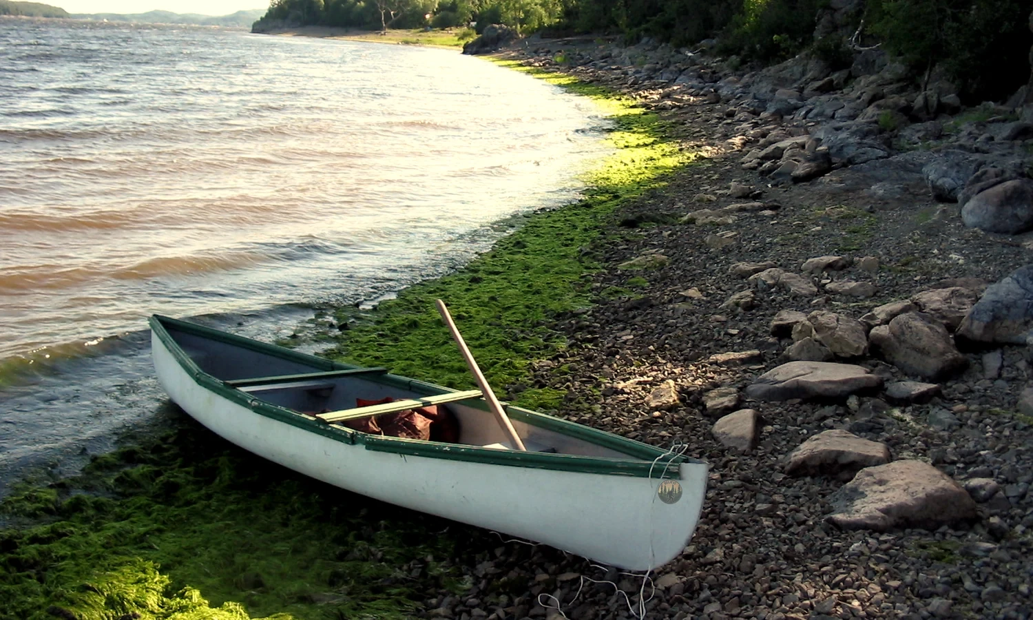 A canoe on the rocky shore of the Kennebecasis River at Rothesay, New Brunswick